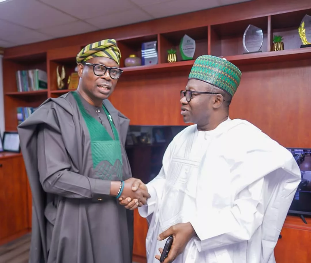 Dr. Iziaq Adekunle Salako Honourable Minister of State for Health & Social Welfare, receiving the Chairman National Population Commission,